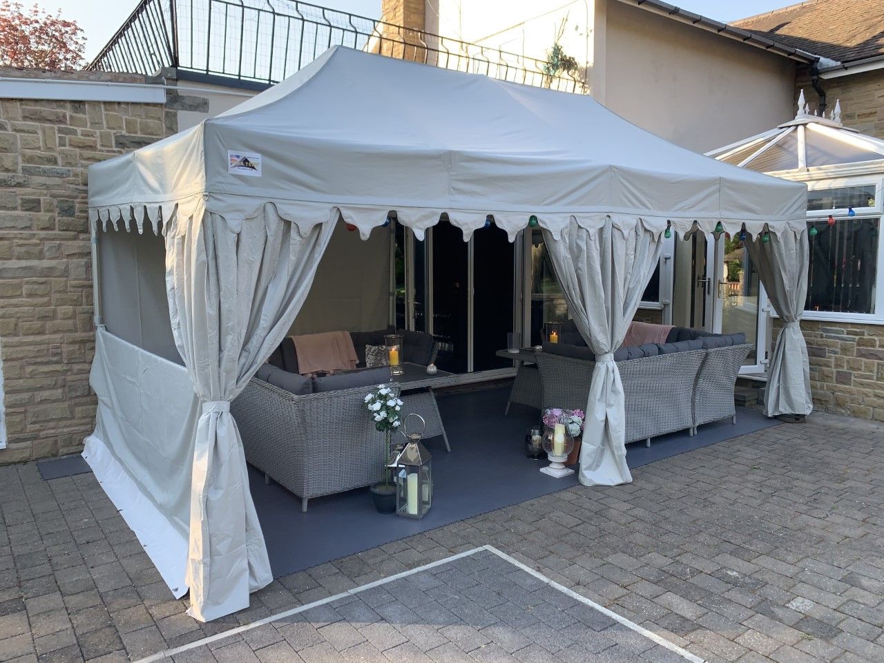 Gazebo with leg covers and curved valance