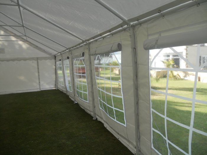 Marquee sidewall with window cover panel rolled up