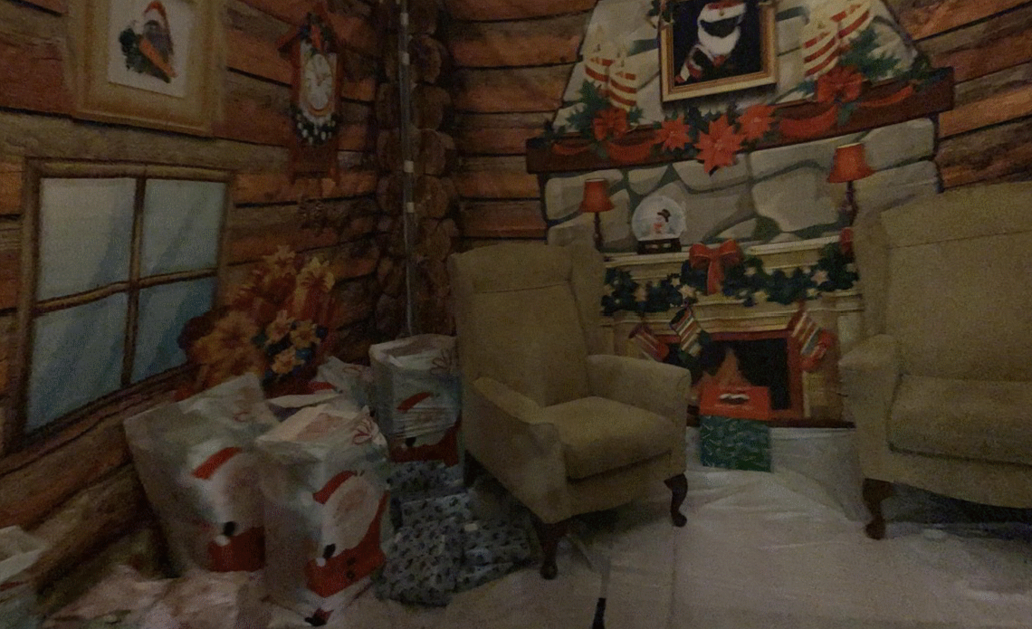 An interior view of a furnished printed Santas Grotto