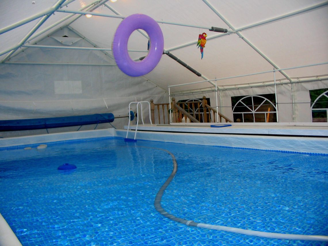 An interior shot of a marquee swimming pool cover