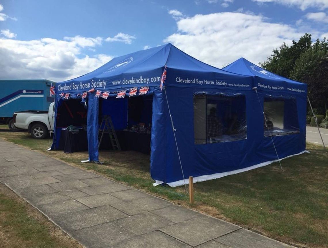 A custom printed business gazebo set up outside