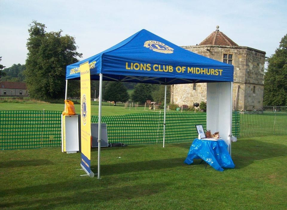 A custom printed business gazebo set up outside