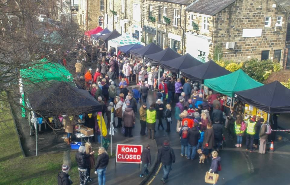 An street market containing many trade gazebos