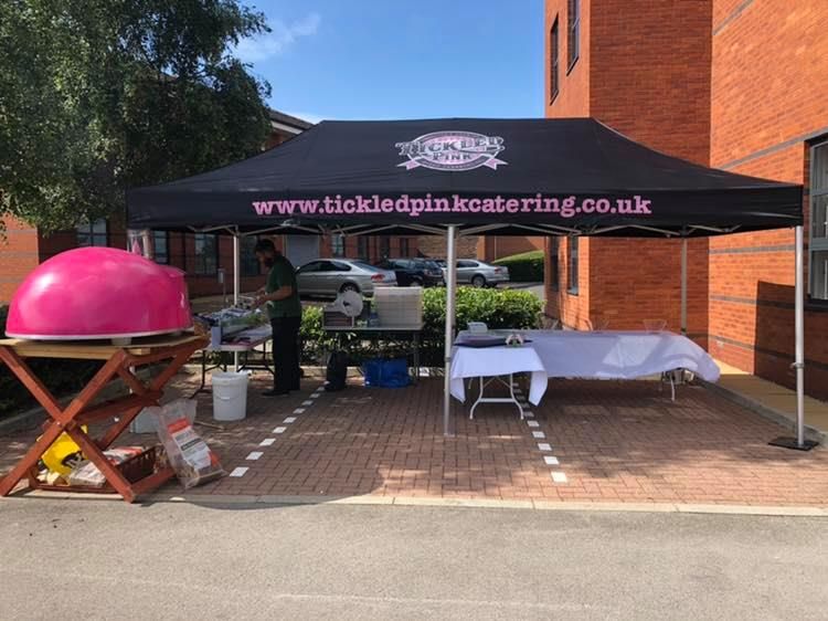 A gazebo with custom printed branding for a streetfood vendor