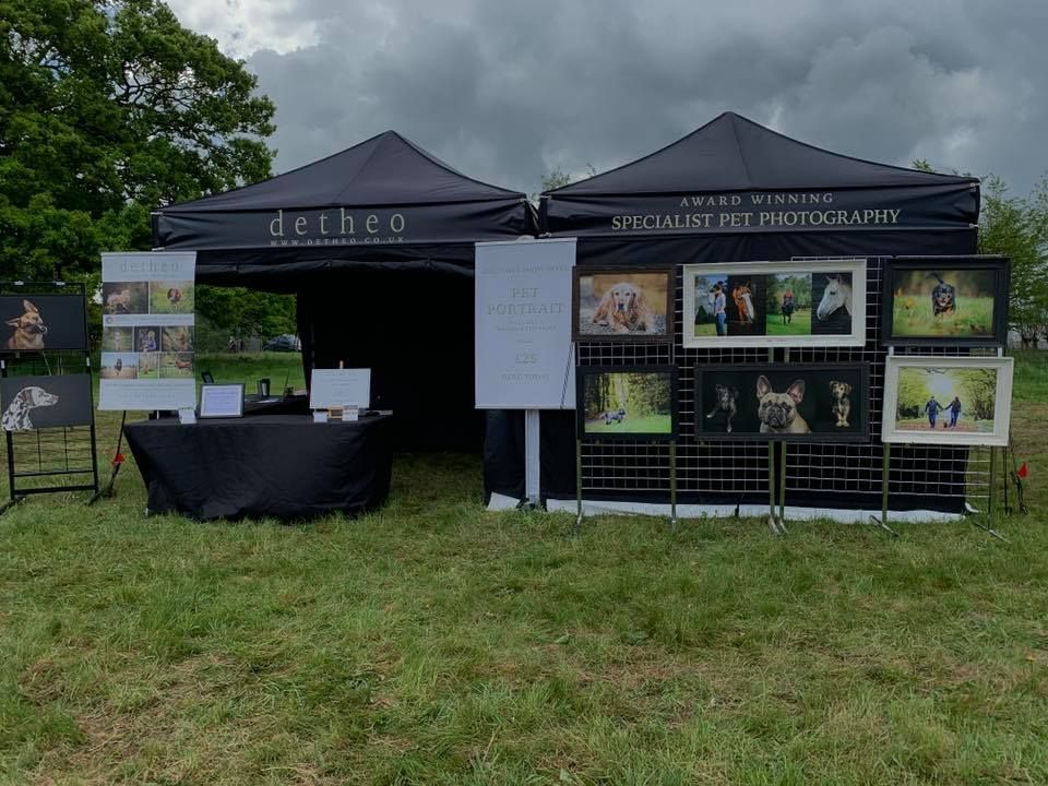 Two trade gazebos with printed canopies at a country show