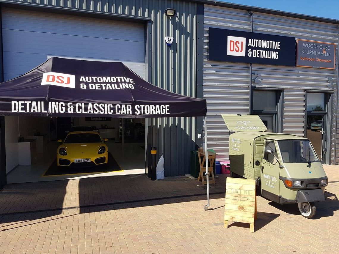 A black and white printed gazebo outside a professional valeting studio