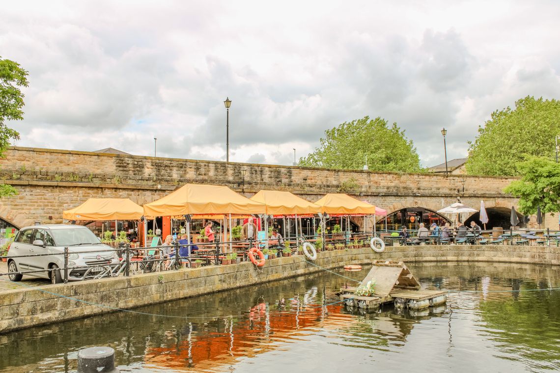 A distant shot of the orange gazebos installed at The Dorothy Pax