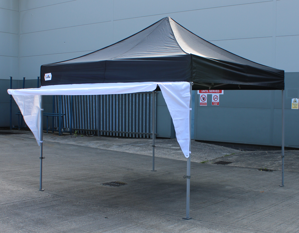 A black pop up gazebo with a white awning shade fixed to the front