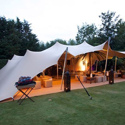 Stretch tent with white canopy set up outdoors