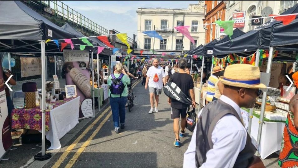 A series of black gazebos at Brixton Market