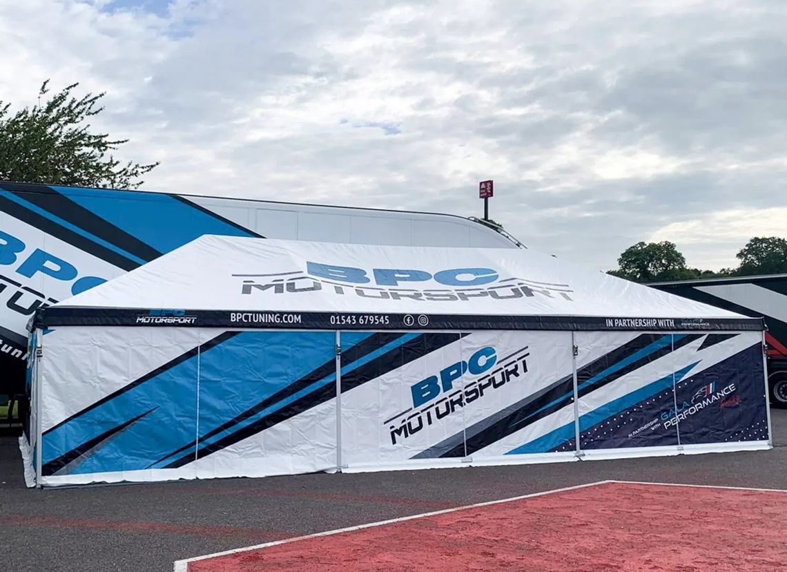 Blue, white and black printed race tent motorsport awning