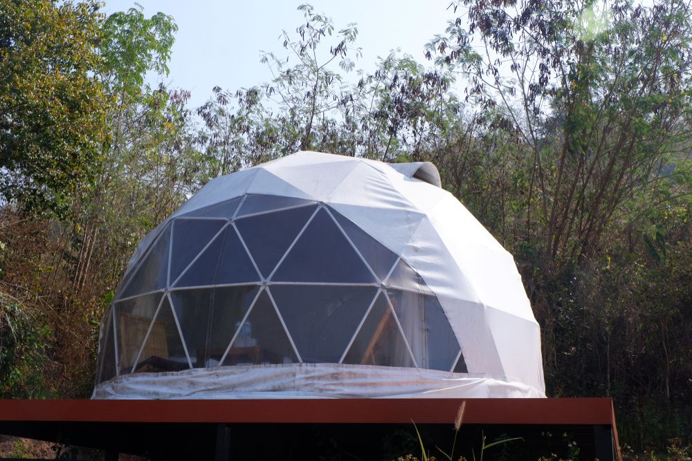 Large geodesic glamping dome on a platform