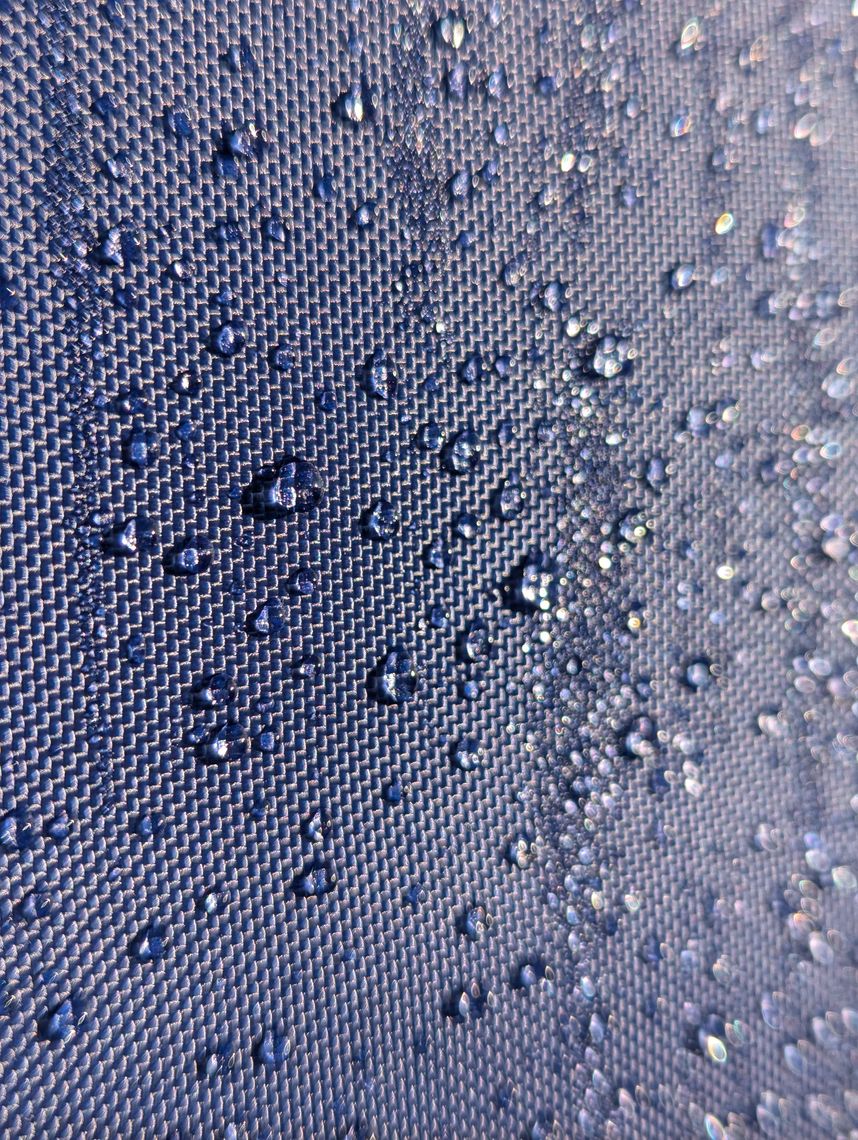 water droplets beading together on a waterproof gazebo canopy