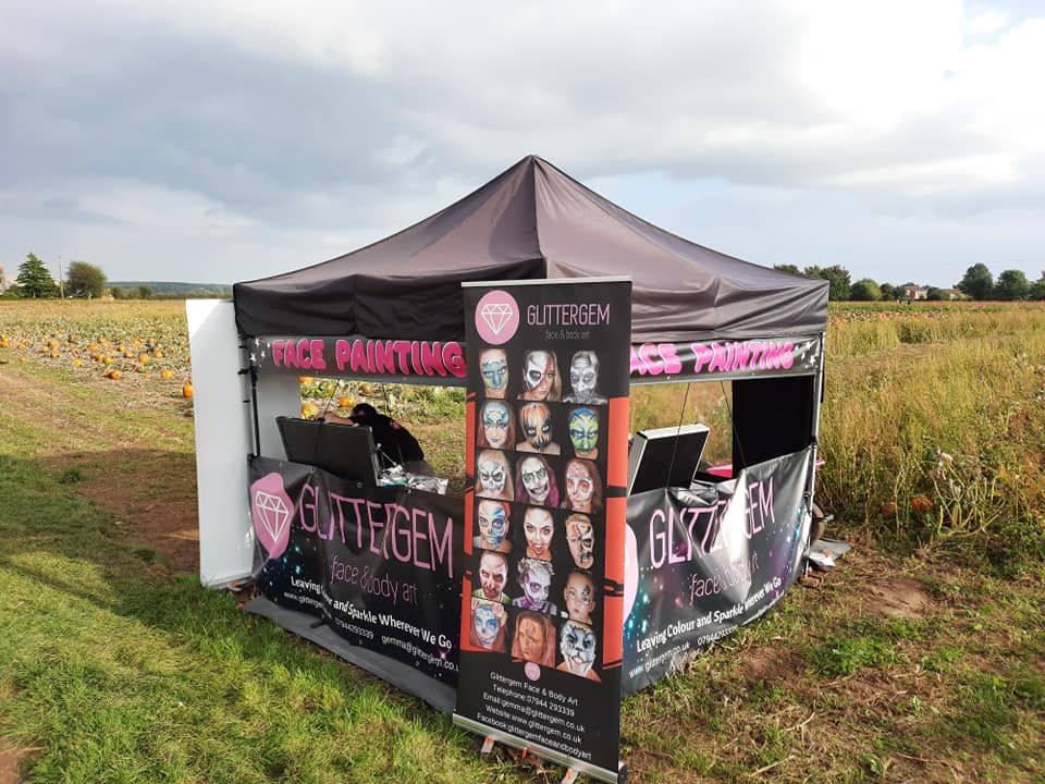 HAlloween facepainting gazebo at a pumpkin picking resort