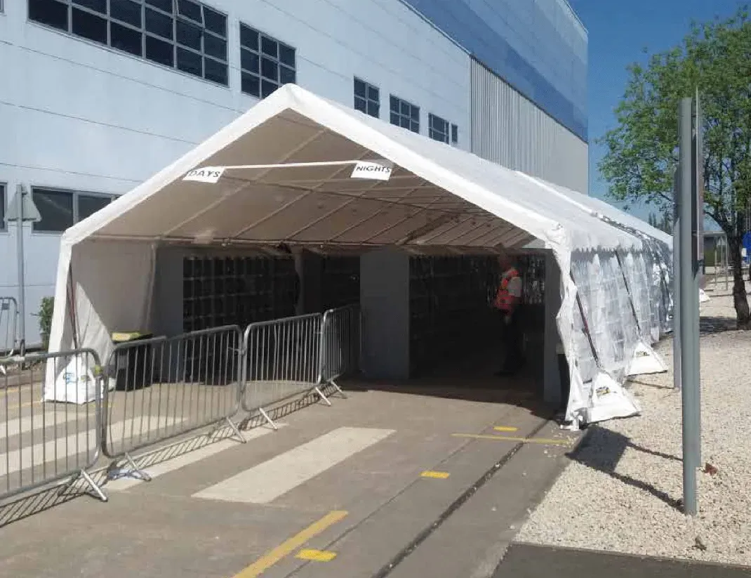 Marquee at a warehouse being used as a checkpoint shelter