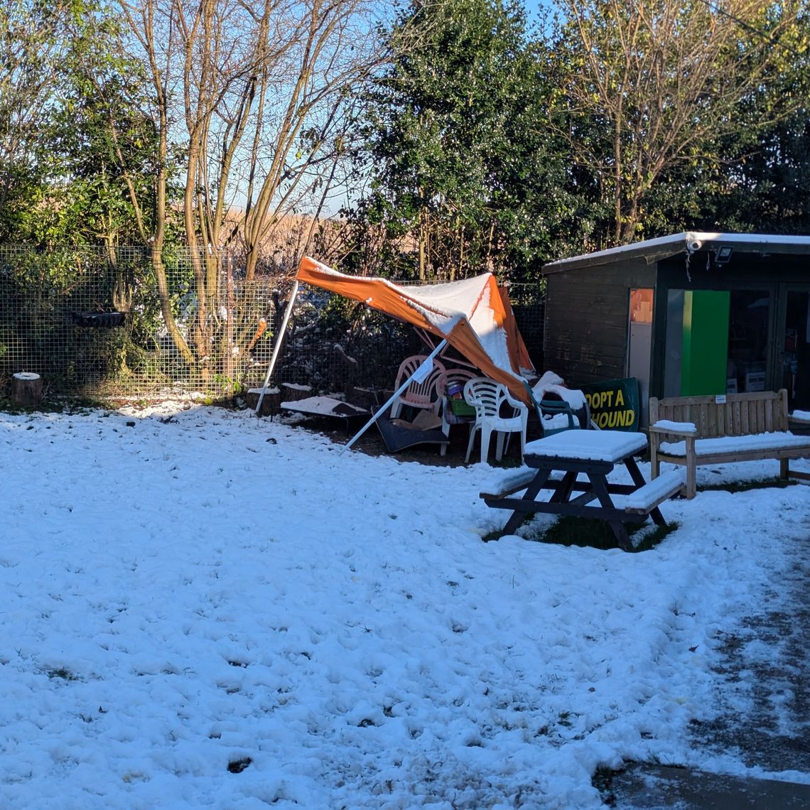 A broken gazebo in the snow