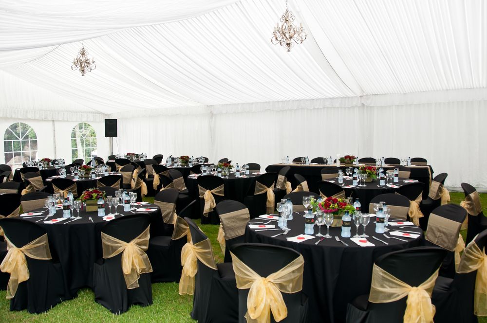 Wedding marquee with furniture dressed in elegant black and white tones