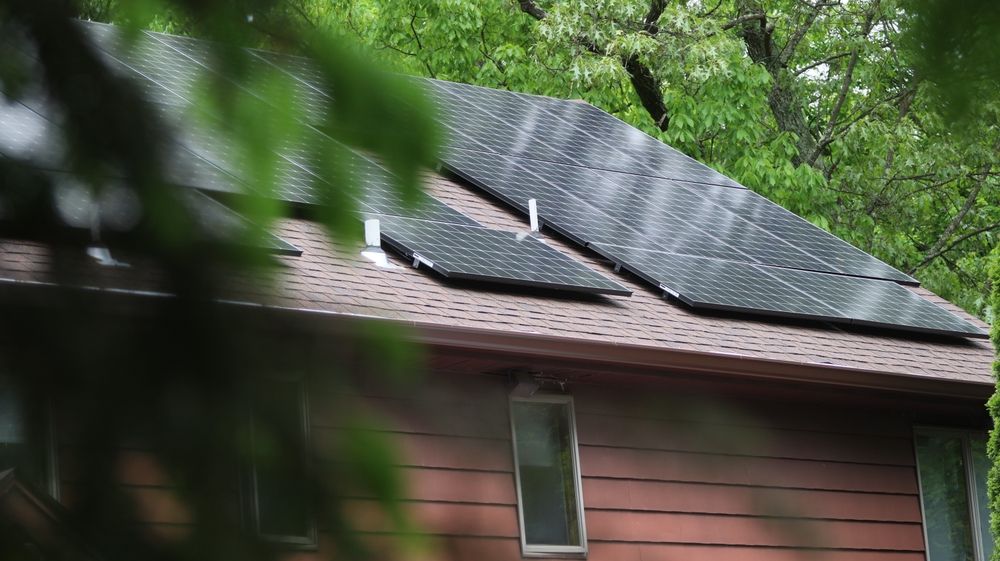 Solar panels on a wooden cabin roof