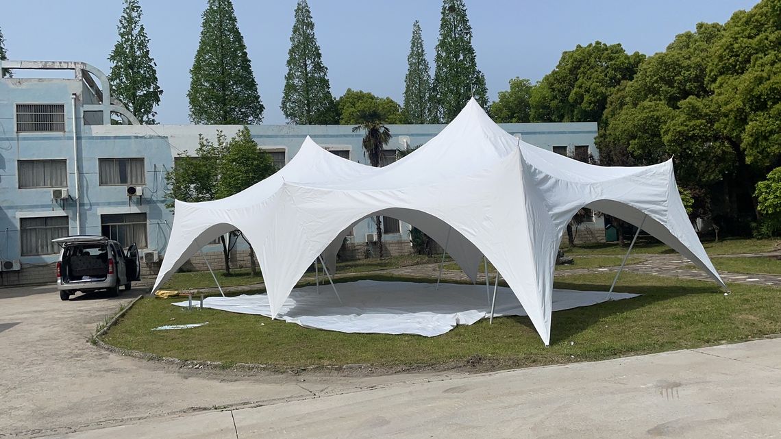 A medium capri tent set out in front of a house