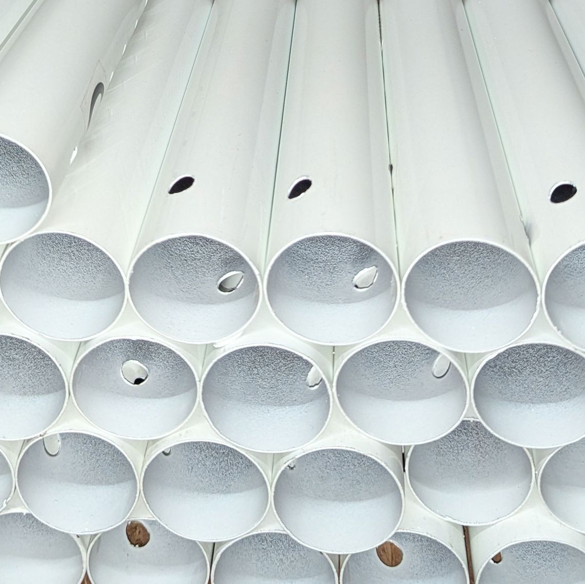 White marquee poles inside Gala Tent's expansive spare part inventory