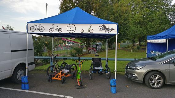 blue sports gazebo with pedal karts beneath it