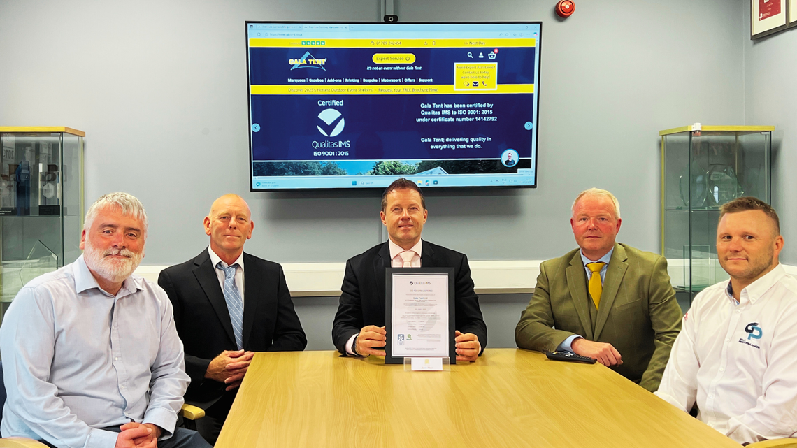 Gala Tent leadership team with ISO accreditation certificate